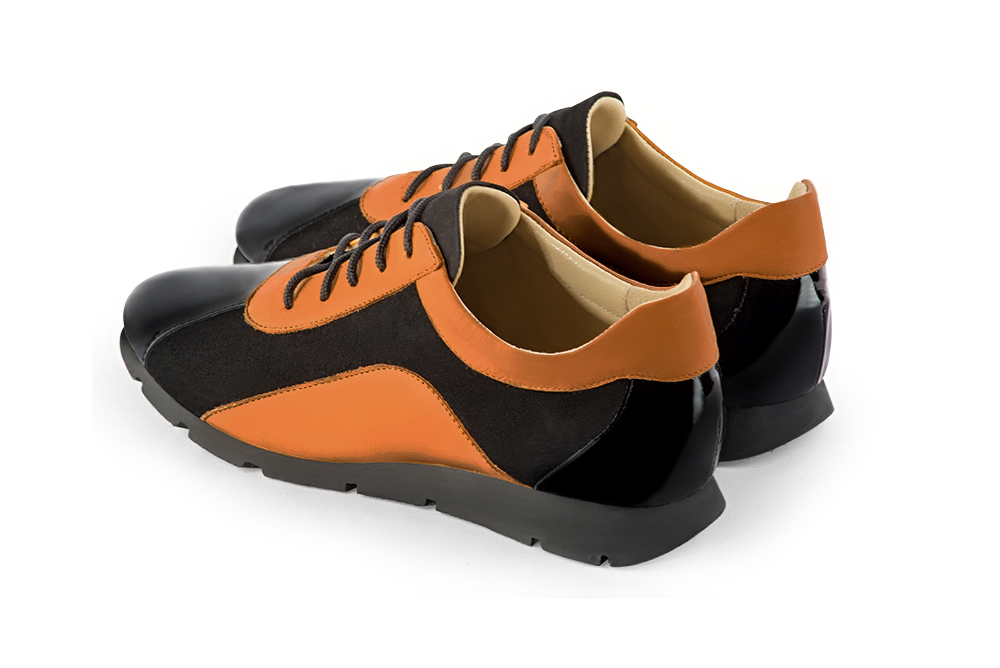 Gloss black and marigold orange women's open back shoes. Round toe. Flat rubber soles. Rear view - Florence KOOIJMAN